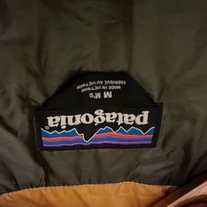 New Patagonia jacket. Worn once. Doesn’t fit.  Mens medium. Yellow/gold.